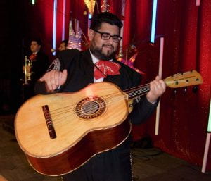 Miguel Cervantes playing the guitarron